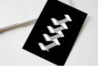 a black and white business card with an image of a spaceship