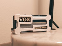 vox classic rock on a table next to a lamp